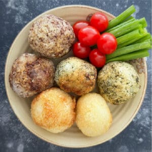 Crispy Tahdig rice balls on plate with veggies