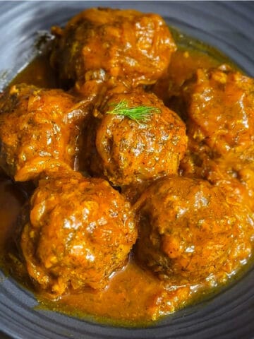 Close up of Persian meatballs in sauce in a bowl