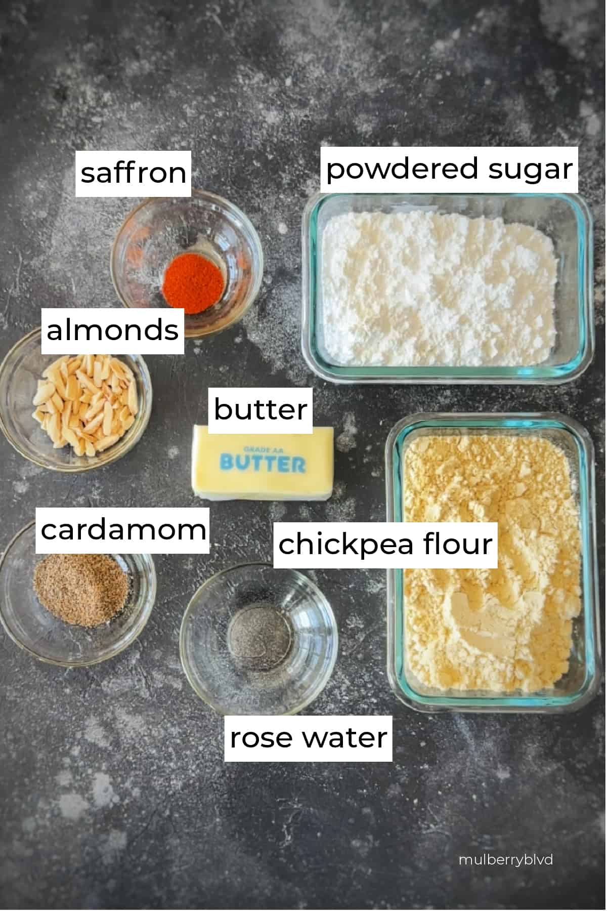 image of the ingredients used to make gluten free chickpea cookies, including rose water, cardamom, chickpea flour, butter, almonds, saffron, and powdered sugar