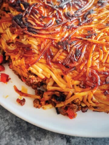 recipe feature an image of Macaroni (makaroni) Persian Spaghetti on a plate, with noodles and meat sauce