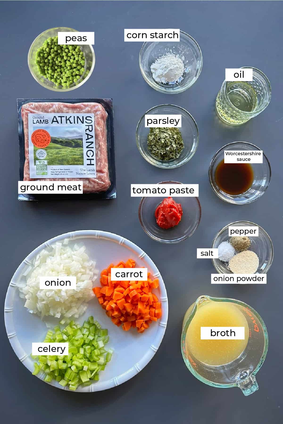 The ingredients needed to make Tahdig Rice Balls with Shepherd's Pie Filling recipe, including celery, onion, carrot, broth, onion powder, salt, pepper, tomato paste, ground meat, parsley oil, cornstarch peas, and Worcestershire sauce